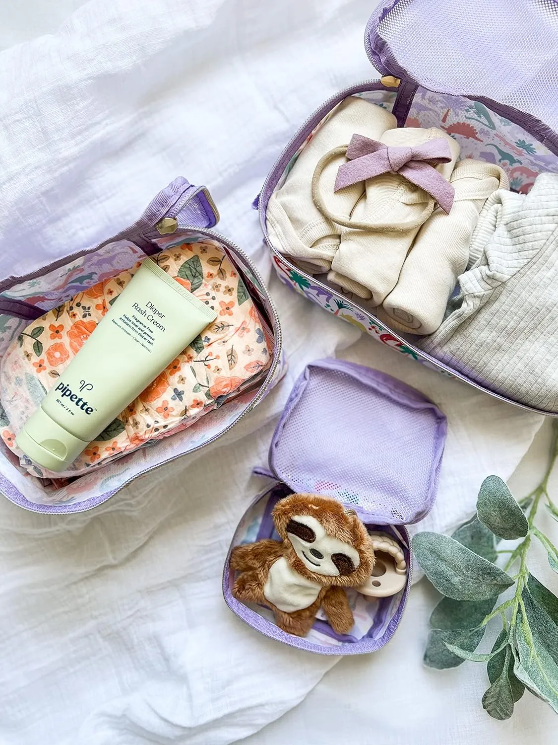 Itzy Ritzy Packing Cubes For Travel – Set of 3 Packing Cubes or Travel Organizers; Each Travel Cube Features a Mesh Top, Double Zippers and a Fabric Handle (Purple Dinosaurs)